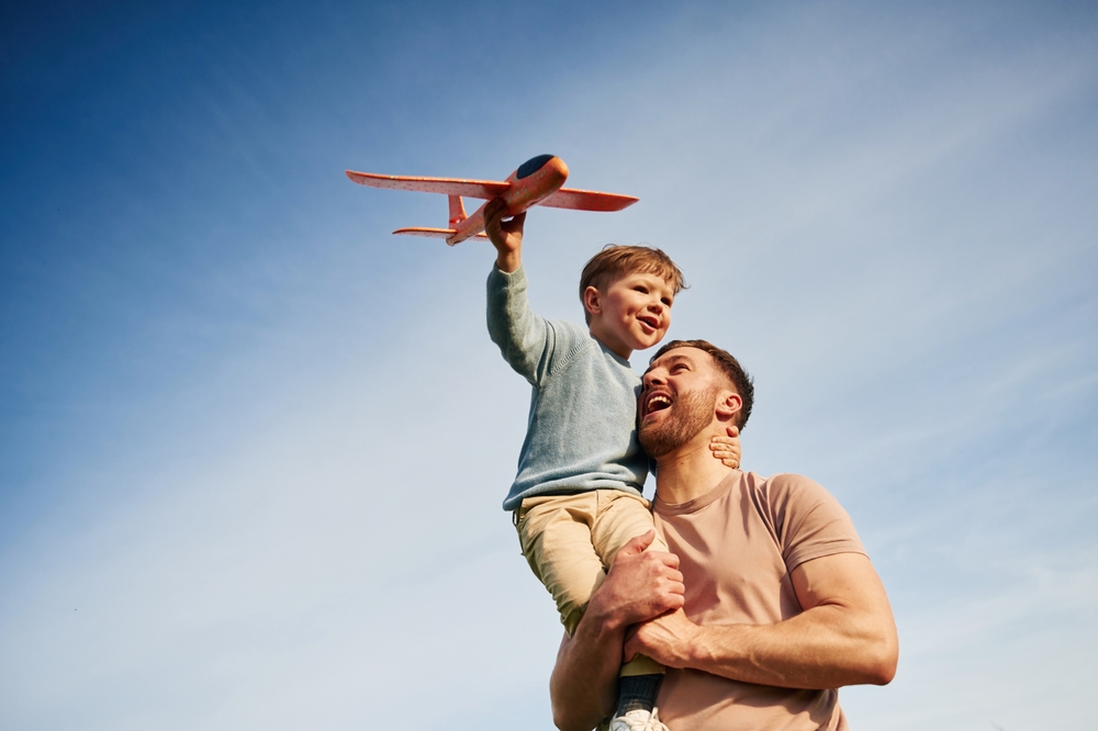 Photo of Father Holding Son